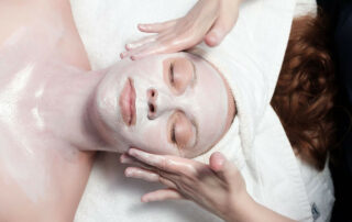 woman receiving facial with mask at Lapis & Oak Spa
