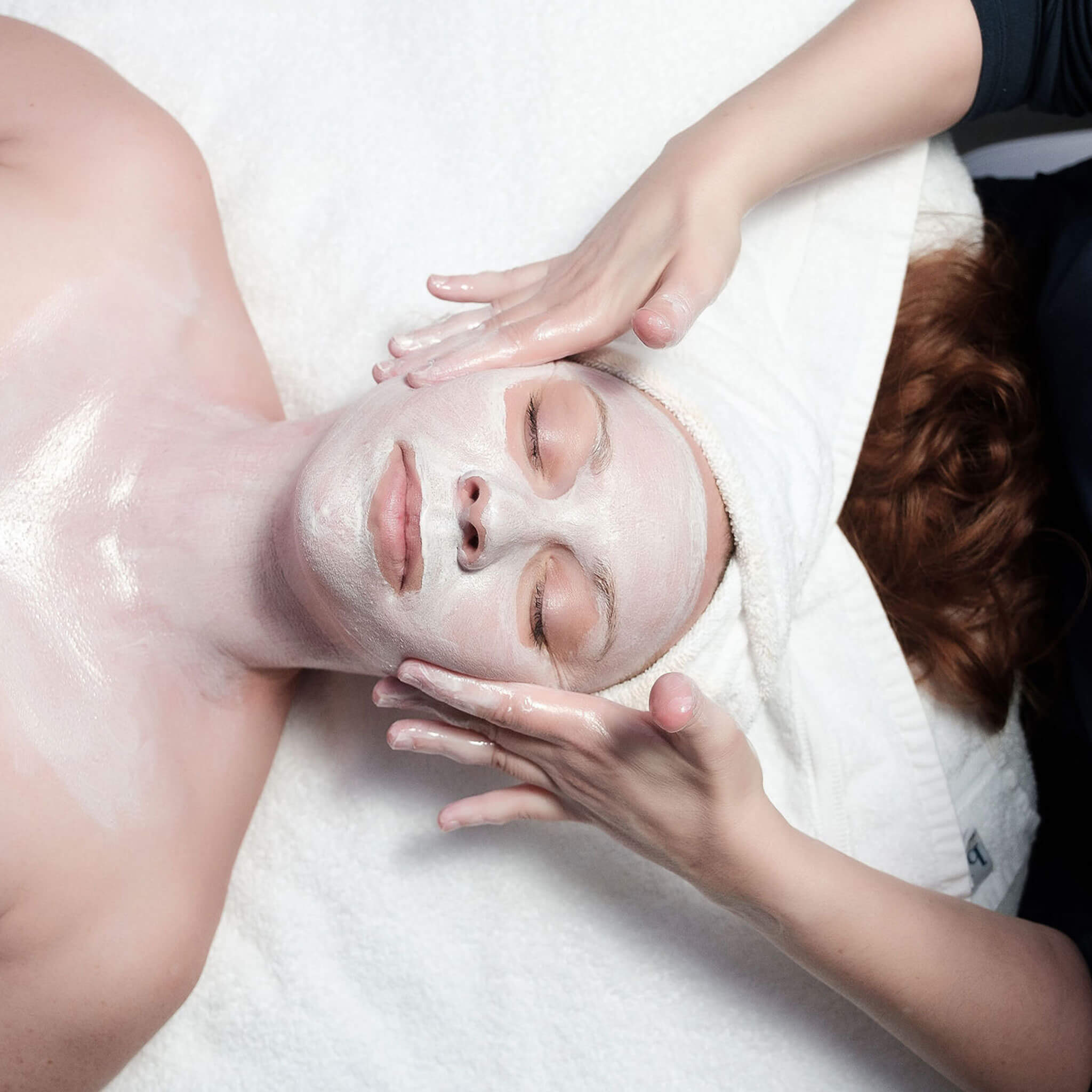 woman receiving facial with mask at Lapis & Oak Spa